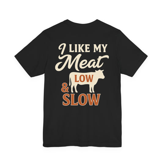 I Like My Meat Low & Slow BBQ t-shirt in black, printed on Bella+Canvas 3001 with Texas barbecue graphic