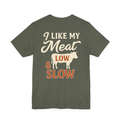 I Like My Meat Low & Slow BBQ t-shirt in heather military green featuring Texas barbecue design on Bella+Canvas 3001