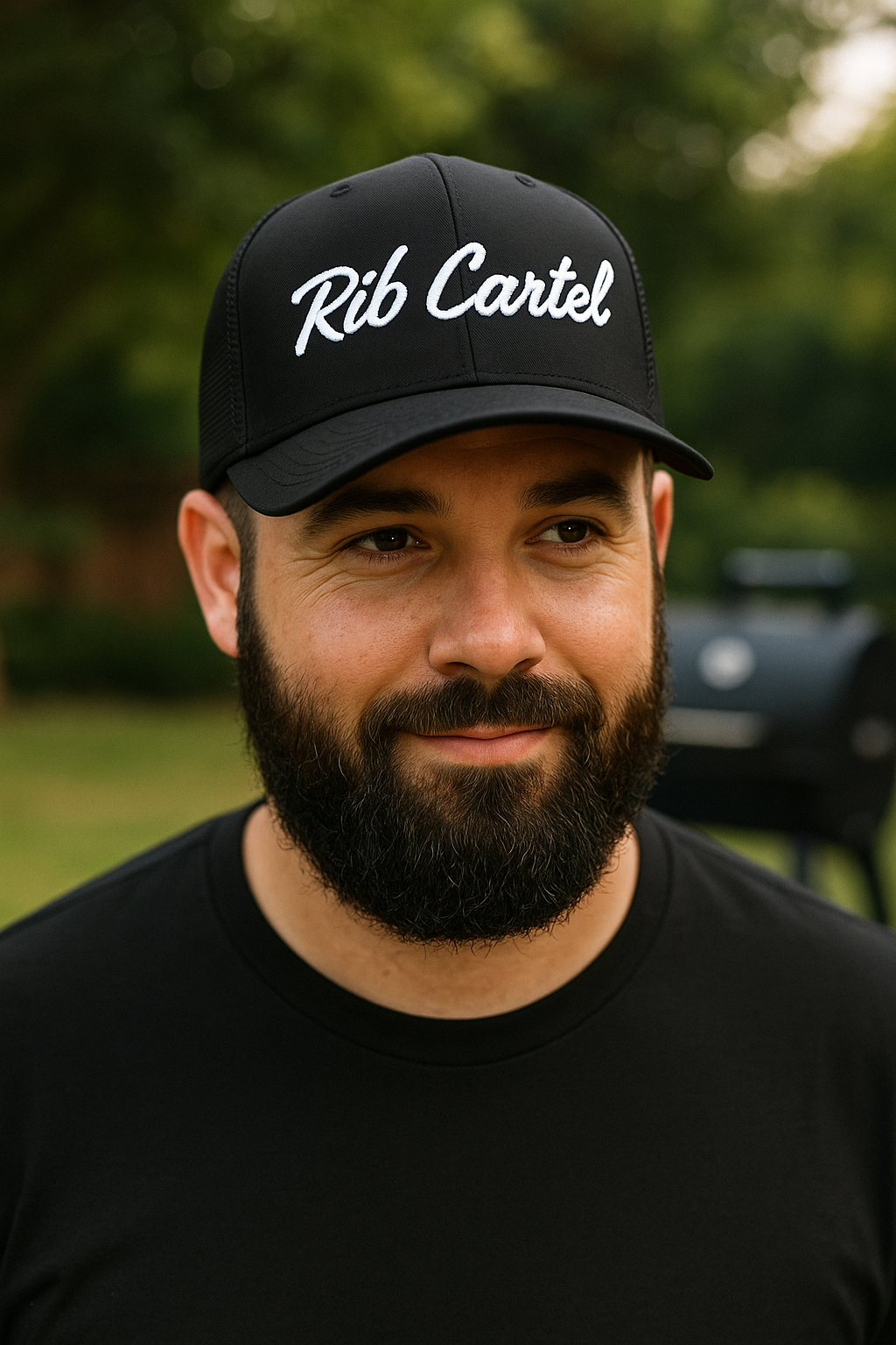 Texas BBQ pitmaster wearing black Rib Cartel Hat from CLC Apparel.